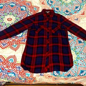 A women’s size medium plaid button up.